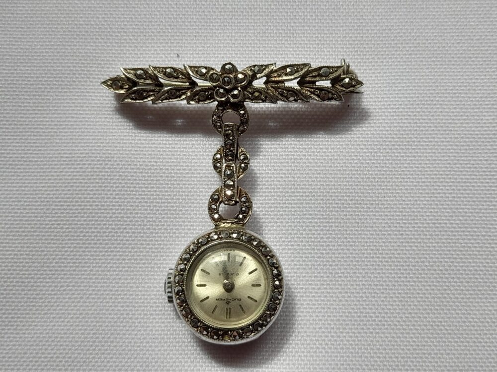 Reloj de dama, de plata, broche o prendedor, Bucherer a cuerda